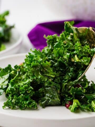 close up of kale salad on plate